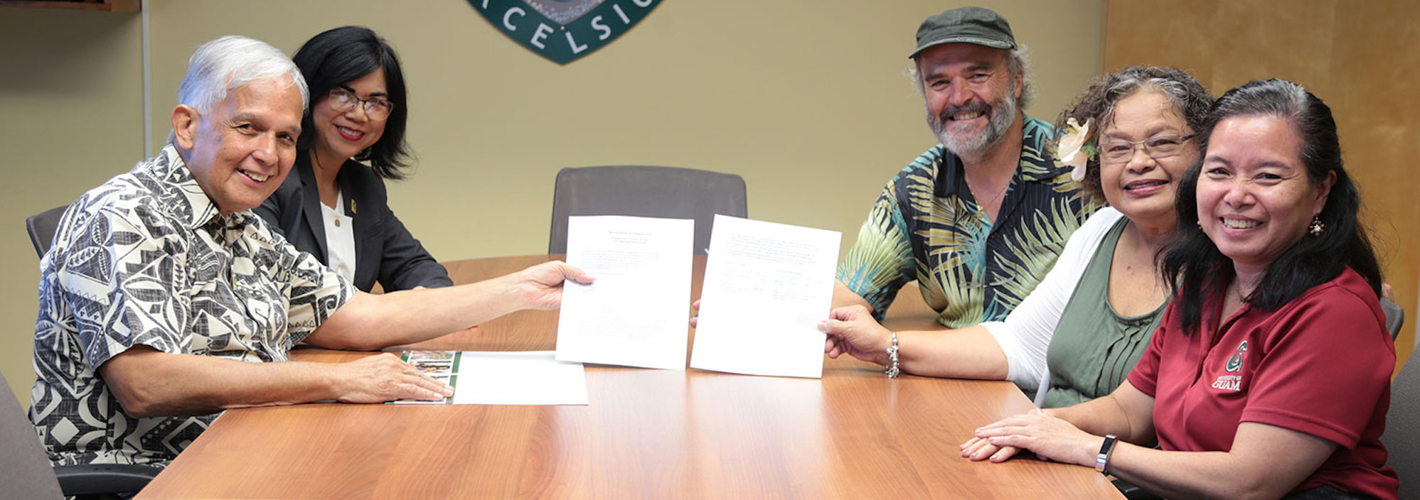 <p style="font-size: 12px;">
	<span style="font-size:26px;"><span style="font-family: arial;"><span style="color: rgb(0, 0, 0);">The University of Guam and LearningCHamoru.com sign agreement to advance learning CHamoru on the campus of UOG and beyond.&nbsp;</span></span></span></p>
<p style="font-size: 12px; text-align: right;">
	<span style="font-family: arial;"><span style="font-size: 20px;"><em><strong><span style="color: rgb(0, 100, 0);">Former President Dr. Robert Underwood,<br />
	Former Senior Vice President Dr. Anita Enriquez,<br />
	Dr. Gerhard Schwab,<br />
	Si&ntilde;ora Rosa Palomo, and<br />
	Late Dean Dr. Margaret Hattori-Uchima</span></strong></em></span></span></p>
